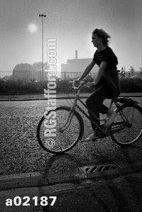 A woman cyclist on Upper Brook Street, Manchester, in 1986.